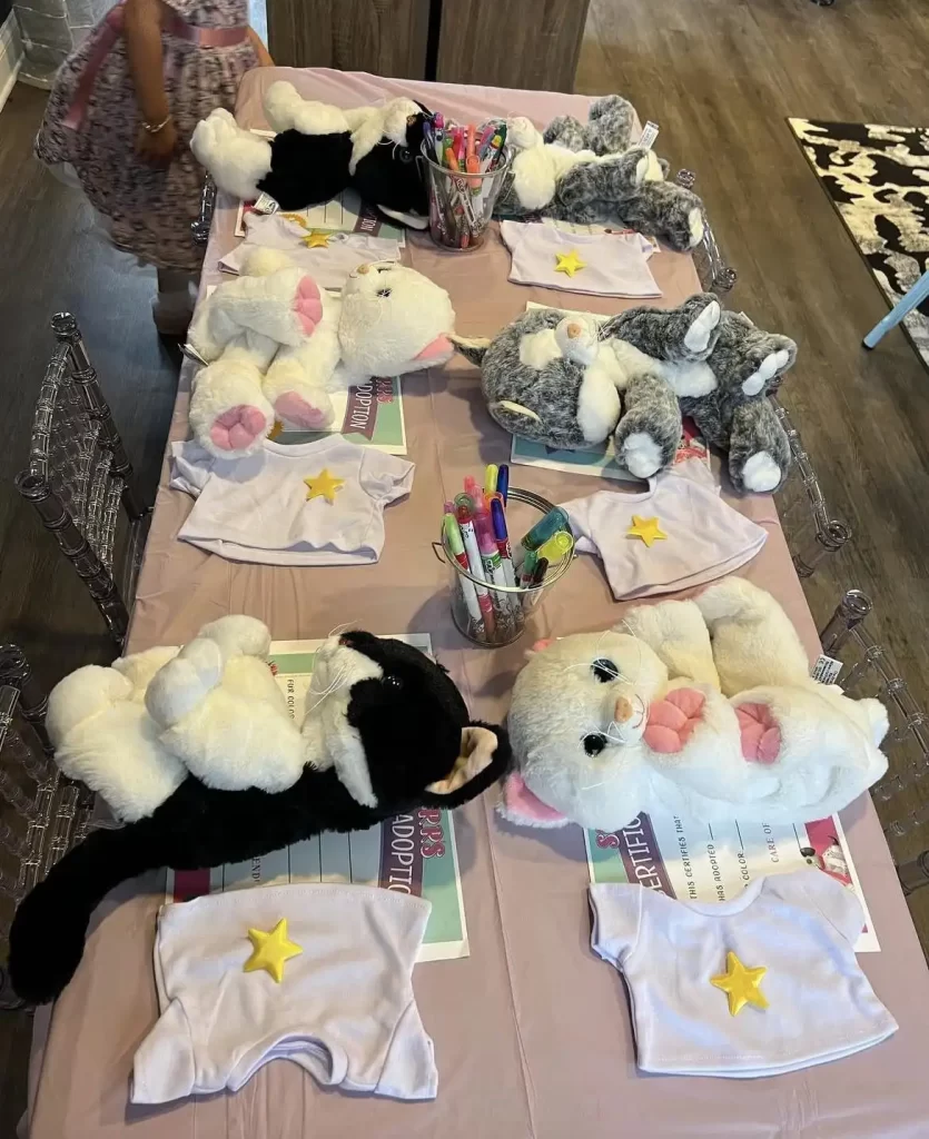 A table full of stuffed animals on a table.