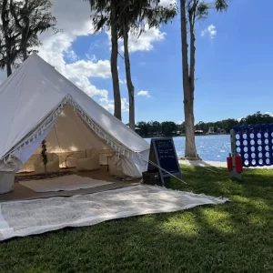 An Ultimate Movie Night Setup Training Package - Transform Your Events set up in the grass next to a lake.