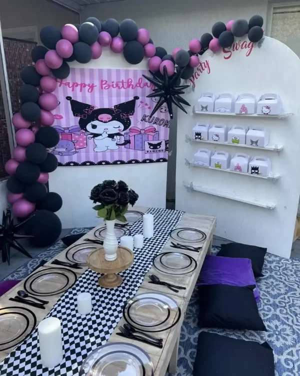 A table set up for a birthday party with the Complete Add-on List including black and pink balloons.