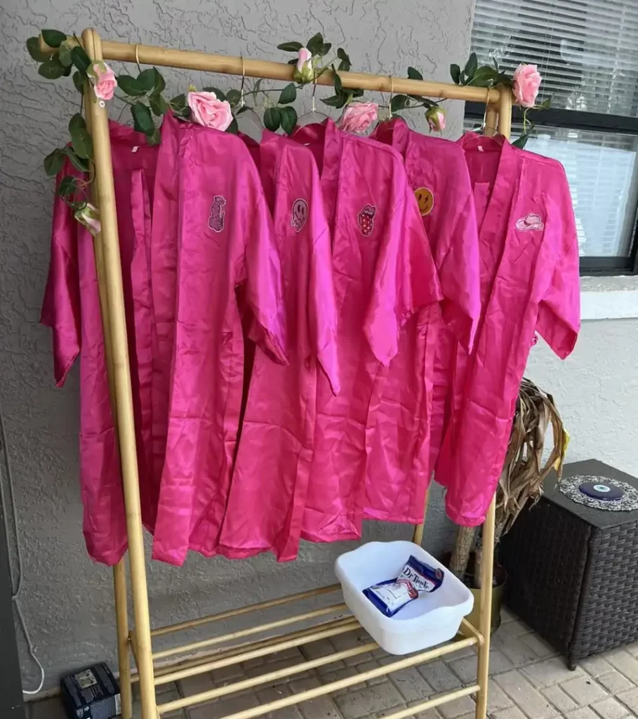 Ultimate Movie Night Setup Training Package - Transform Your Events with pink robes hanging on a rack.