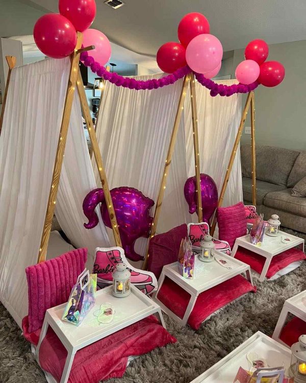 An Extra-Large Teepee Bundle with DIY Plans - Perfect for All Ages with pink balloons and tables.