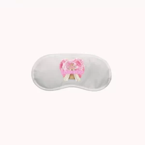 A white Custom Logo Sleep Mask with a pink bow on it.