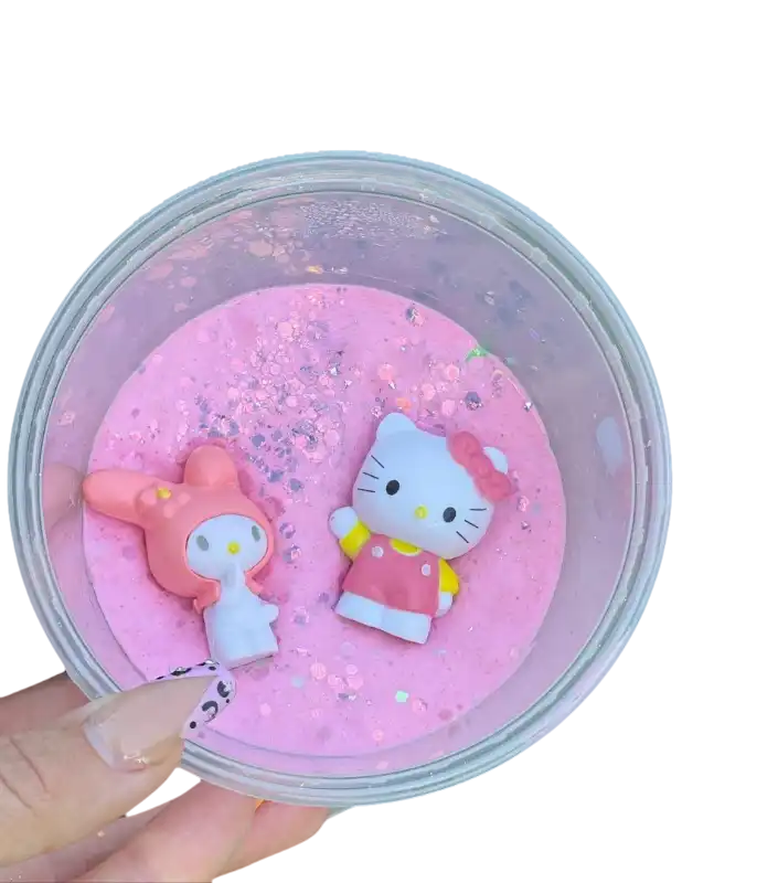 Hello kitty figurines displayed in a pink bowl.